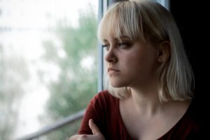 Woman thinking long and hard about childhood trauma