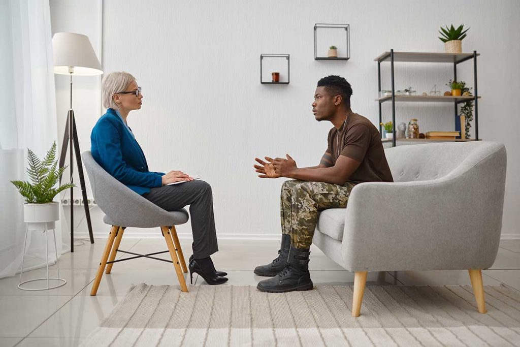 Two people discuss what is a veterans treatment program