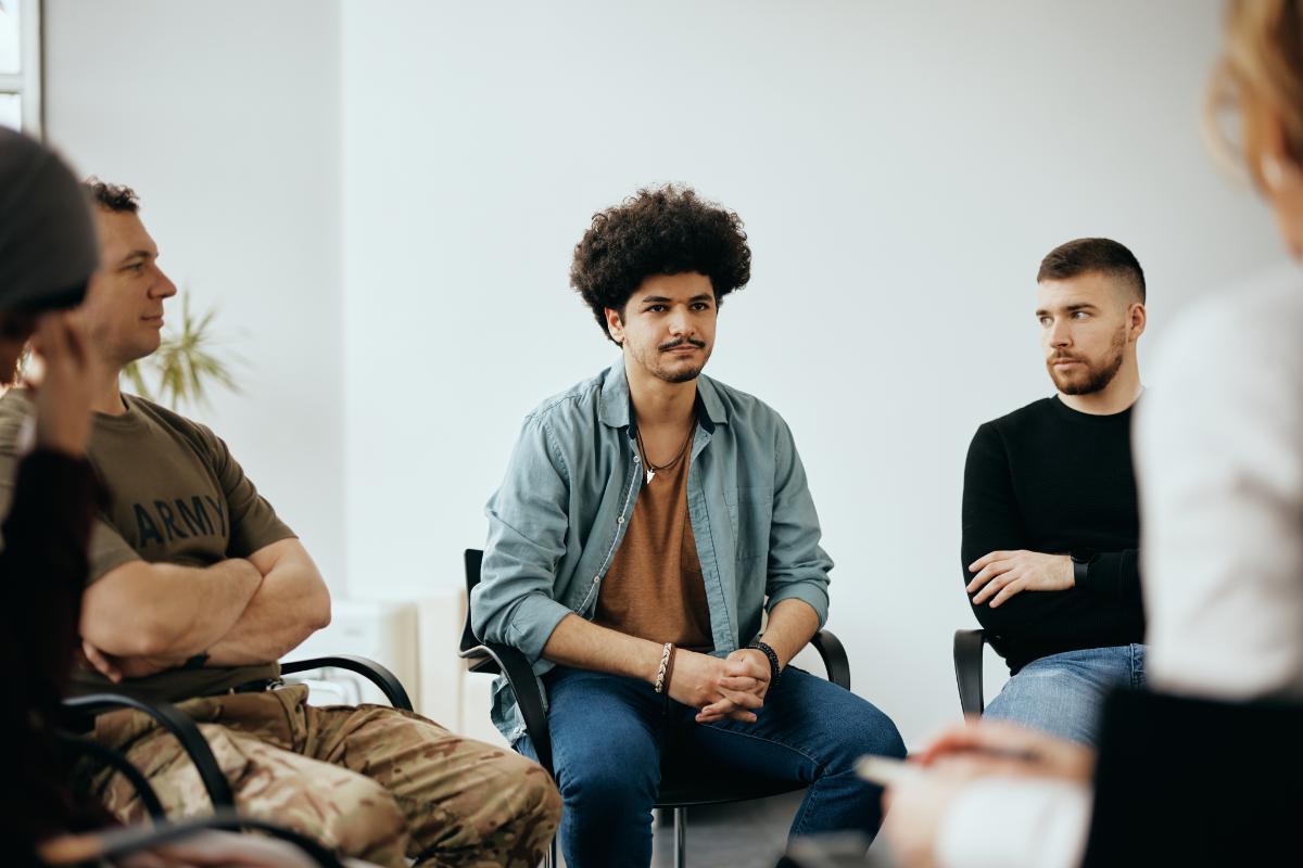 a group of people participate in group therapy for recovery