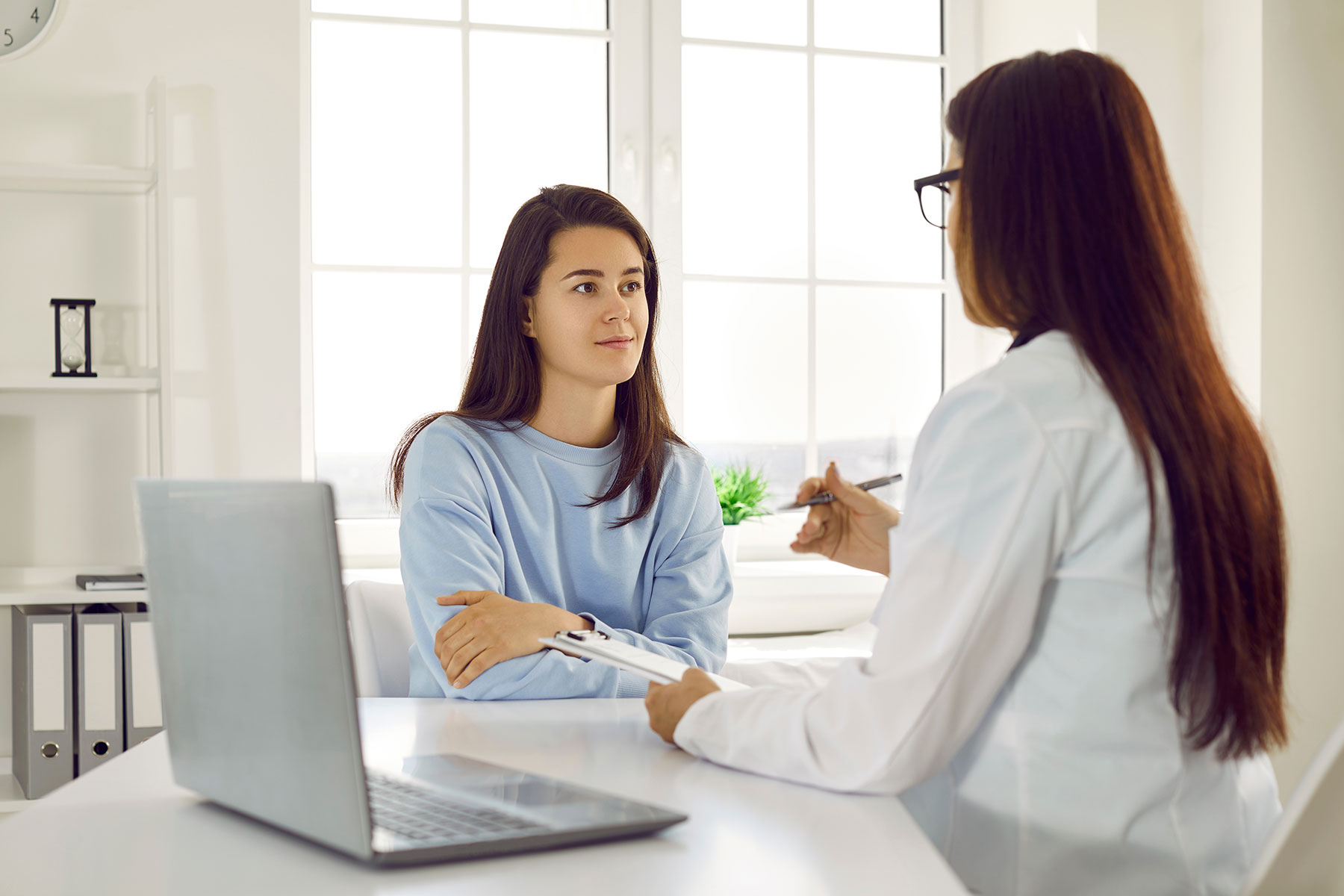 two people talk at a kitchen counter about intensive outpatient care cohasset