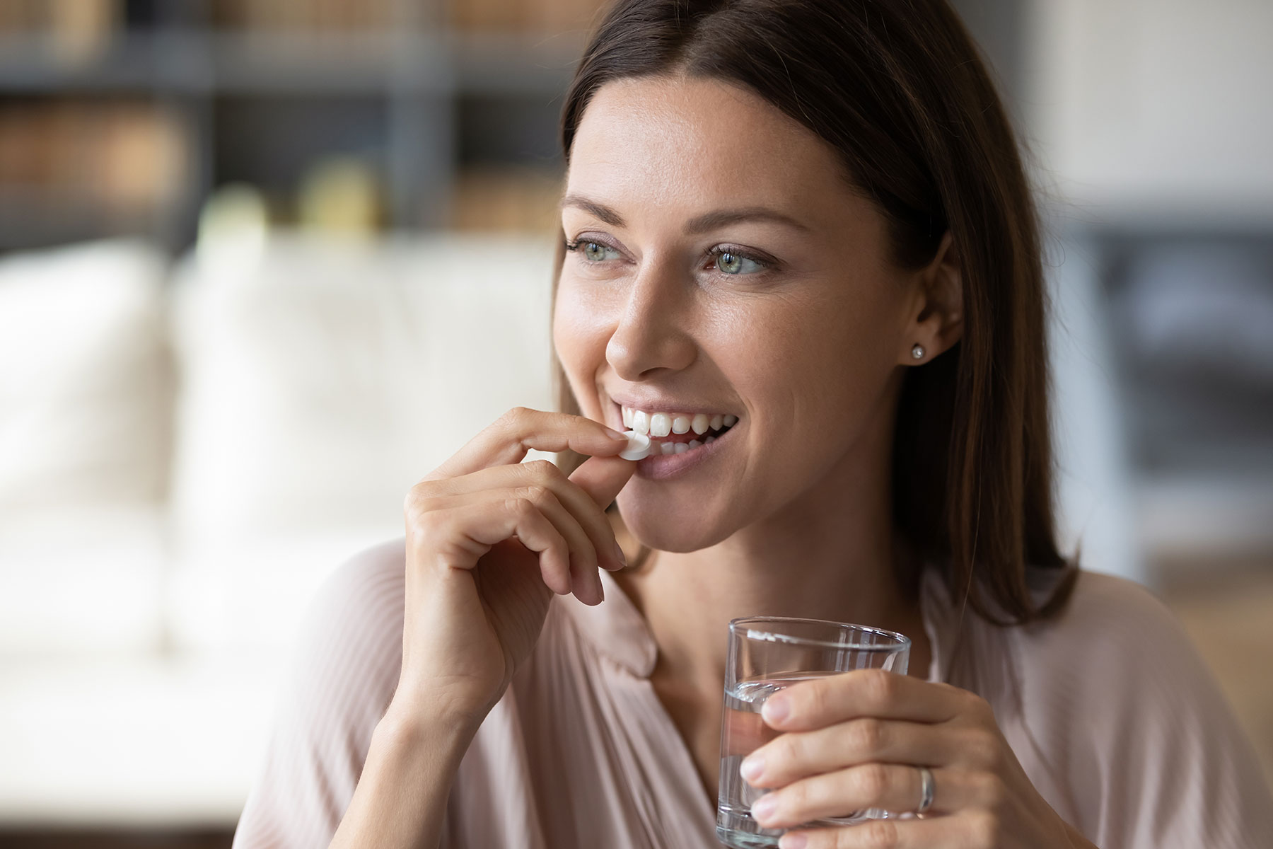 a person takes suboxone with water to show benefits of suboxone