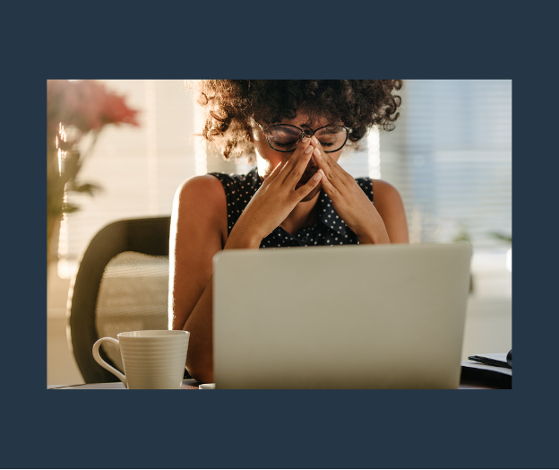 Woman with functional alcoholism sits at computer and tries to work